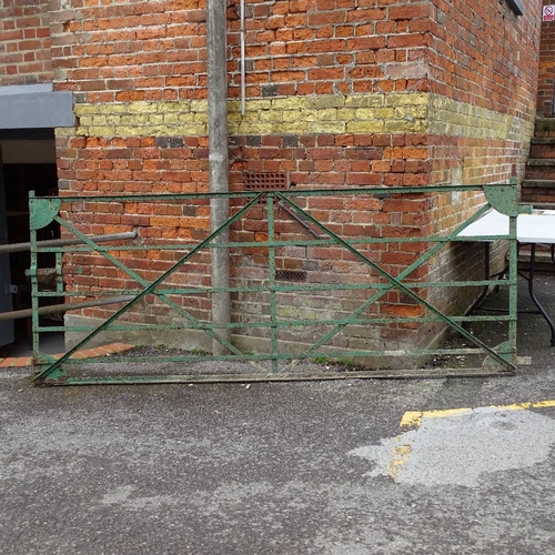 2035 - A green painted cast-iron drive gate, L275cm, H113cm