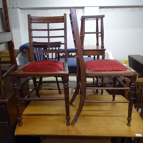 2038 - A pair of Arts and Crafts side chairs, with leather backs and turned legs