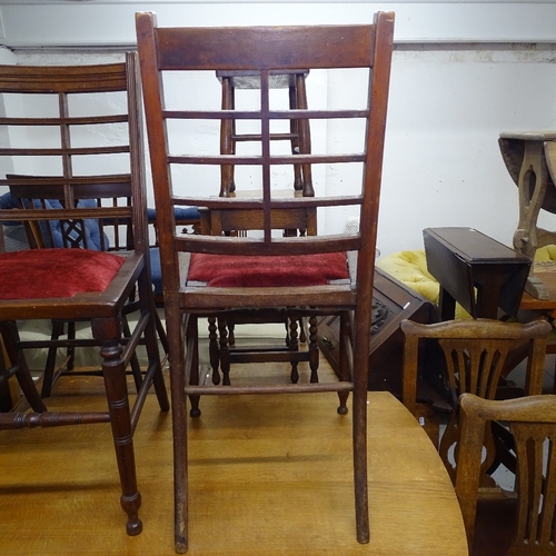 2038 - A pair of Arts and Crafts side chairs, with leather backs and turned legs