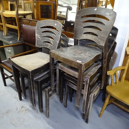 2054 - A set of 7 stained ply ladder-back style stacking chairs