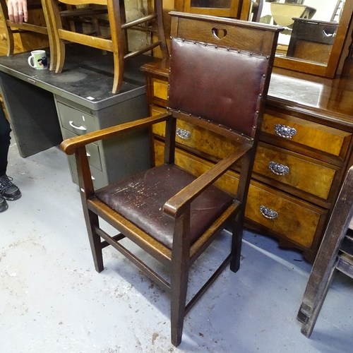 2056 - An Arts and Crafts oak armchair, with heart-shaped cut-out to the back panel