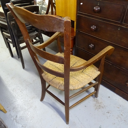 2057 - A pair of French walnut ladder-back rush-seated elbow chairs