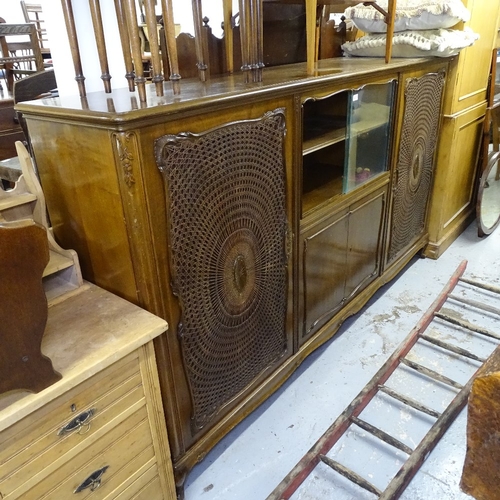 2072 - A French stained wood cabinet, with cane-panelled and sliding glazed cupboard doors, L224cm, H25cm, ... 