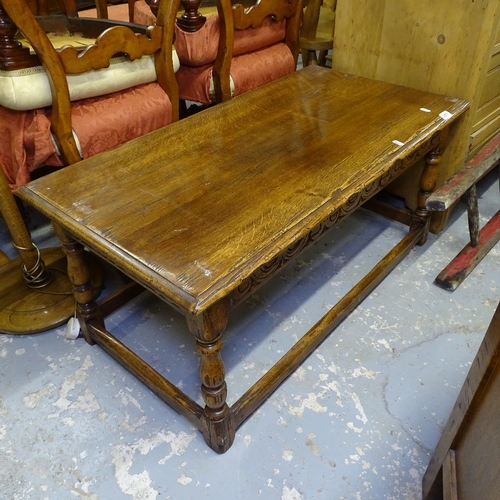 2075 - An Ipswich oak design rectangular coffee table, with carved frieze and splayed baluster legs, W95cm,... 