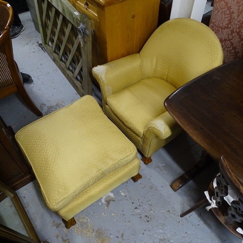 2091 - An upholstered arch-top armchair, and matching footstool