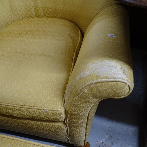 2091 - An upholstered arch-top armchair, and matching footstool