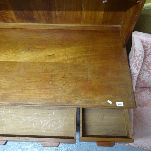 2101 - A Heals style mid-century teak writing desk, with raised shelved back, and fitted drawers under, W11... 