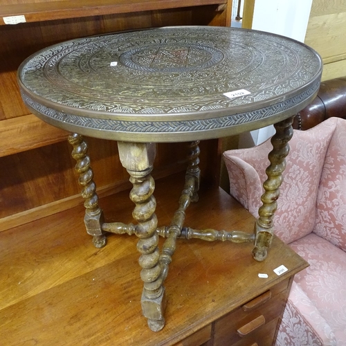 2102 - A Persian brass table-top on folding base, W59cm, H59cm