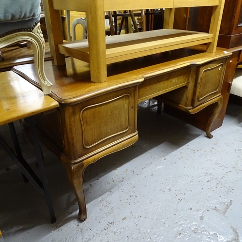 2104 - A French stained beech kneehole writing desk, on cabriole legs, W142cm, H78cm, D71cm, kneehole width... 