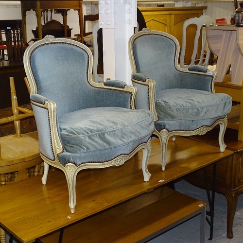 2109 - A pair of Continental cream painted and upholstered armchairs