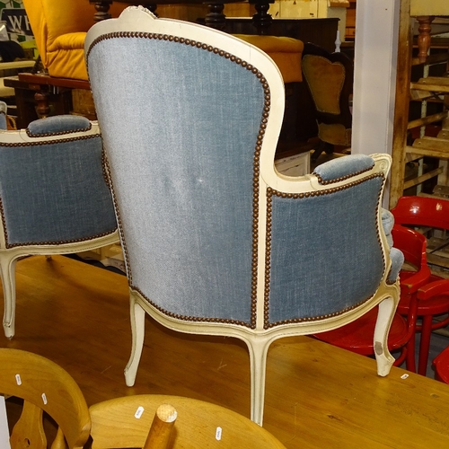 2109 - A pair of Continental cream painted and upholstered armchairs