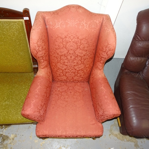 2112 - An Edwardian upholstered wing armchair