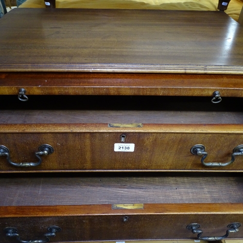 2138 - A mahogany bachelor's chest in Georgian style, with brushing slide, 4 long drawers under, and bracke... 