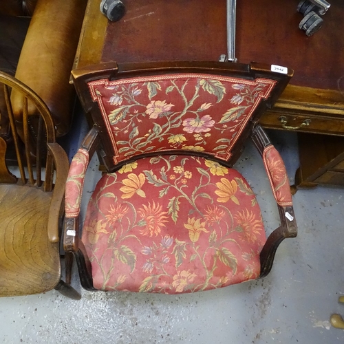 2142 - A 19th century elm-seated wheel-back elbow chair, and an Antique mahogany elbow chair (2)