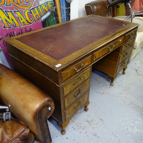 2143 - A walnut and mahogany twin-pedestal writing desk, W136cm, H76cm, D73cm, kneehole width 52cm and heig... 