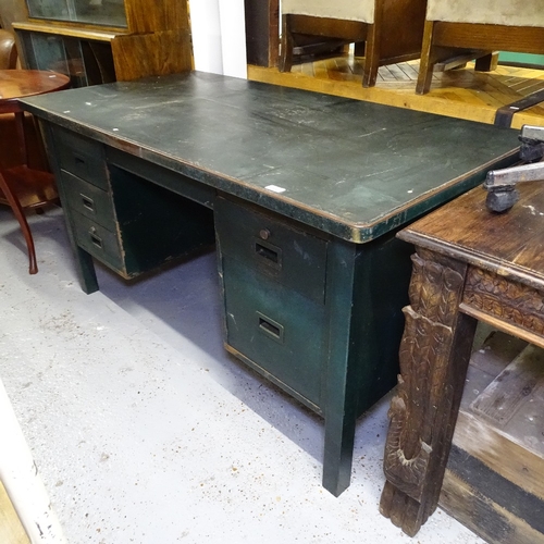 2150 - An industrial green painted metal desk, with fitted drawers, W146cm, H78cm, D76cm, kneehole width 53... 