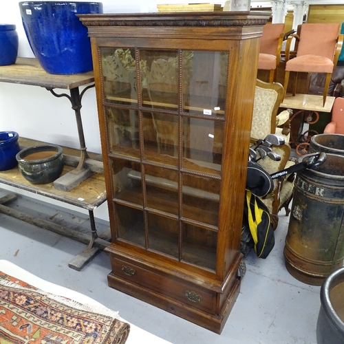 2192 - A Georgian style hardwood bookcase, with lattice-glazed door, and drawer under, W85cm, H168cm, D33cm