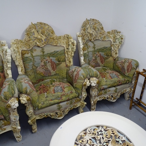 2200 - A pair of matching bespoke made armchairs, with carved winged horse and figure crests, made in Egypt... 