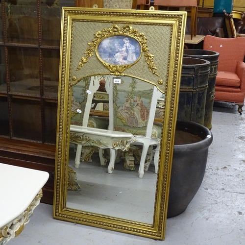 2214 - A gilt-gesso framed rectangular wall mirror, with applied ribbon decoration and oval inset panel, W6... 