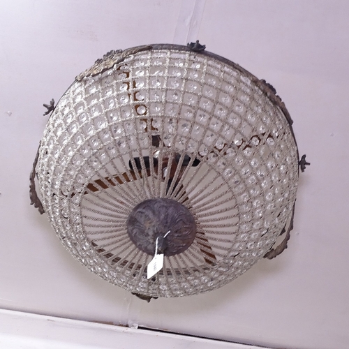 1940 - A cast-metal and bright mesh light fitting, W50cm