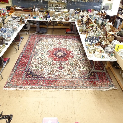 1946 - A handmade red ground Tabriz wool carpet, 394cm x 300cm