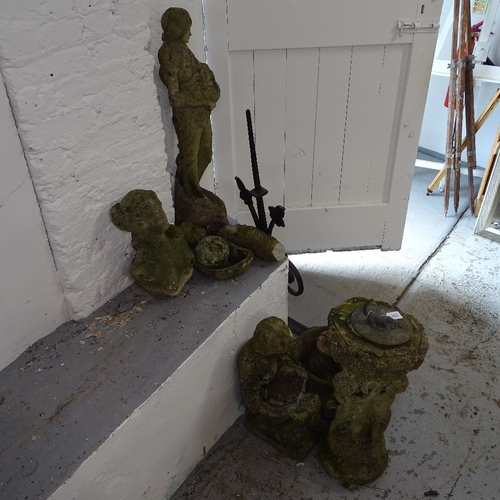 1951 - A group of weathered concrete garden statues, birdbath and sundial