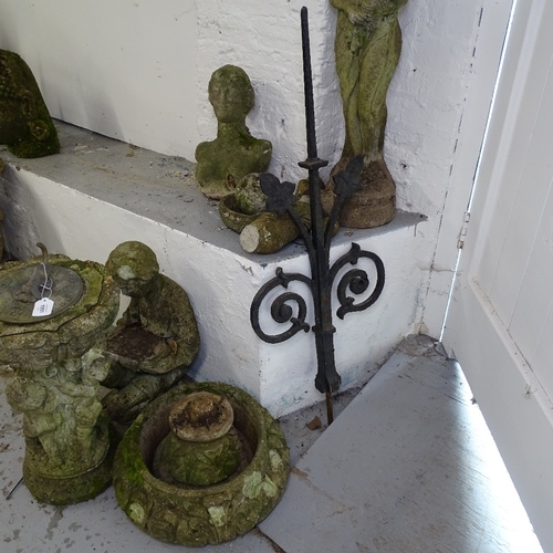 1951 - A group of weathered concrete garden statues, birdbath and sundial