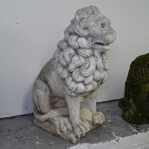 1955 - A weathered and painted concrete garden statue, study of a seated lion, H60cm