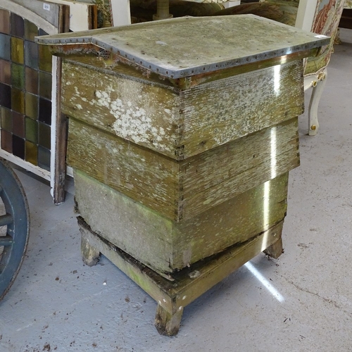 1957 - A weathered sectional beehive, W64cm, H80cm