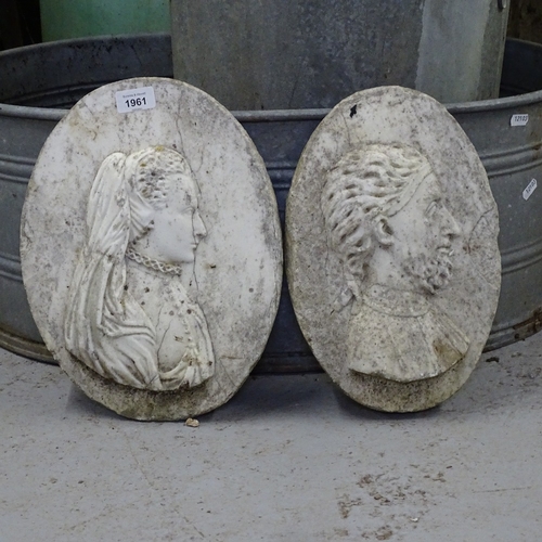 1961 - A pair of marble oval plaques, with embossed figural decoration, W27cm, L34cm