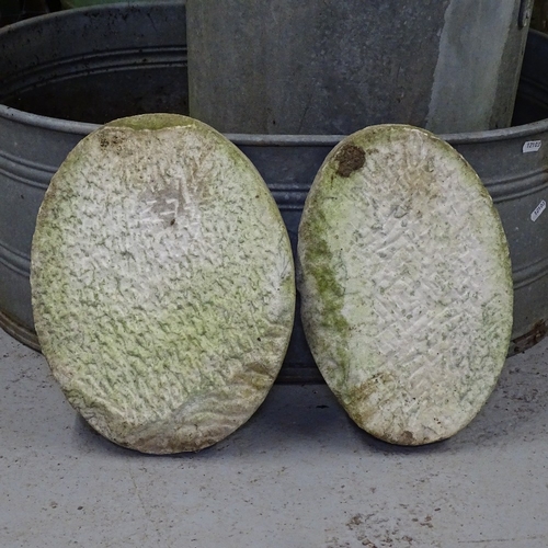 1961 - A pair of marble oval plaques, with embossed figural decoration, W27cm, L34cm