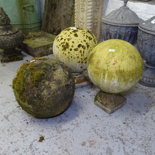 1962 - 2 similar weathered terracotta ball finials on stands, and another (3)