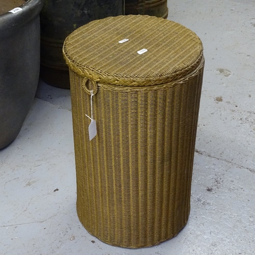 1981 - A circular gold Lloyd Loom laundry bin