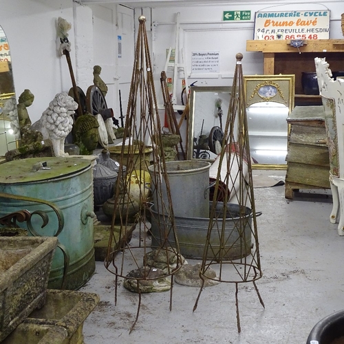 1986 - A pair of graduated wrought-iron garden obelisks, tallest 145cm