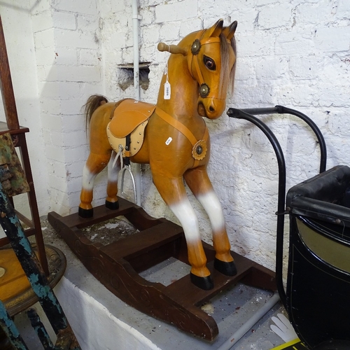 2009 - A small painted rocking horse, height 90cm