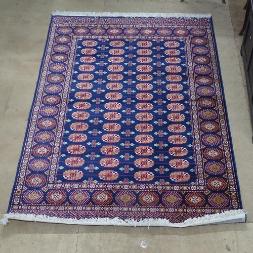 1868 - A Kerman blue ground Iranian silk rug, 225cm x 150cm, with label