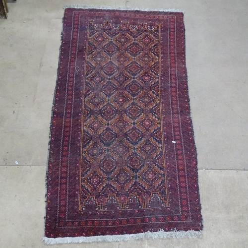 1870 - An Antique red ground Afghan runner, with symmetrical geometric pattern, 215cm x 105cm