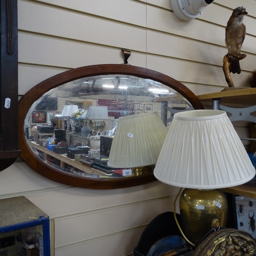 138 - An early 20th century inlaid satinwood oval bevelled-edge wall mirror, 84cm x 46cm and a brass hamme... 