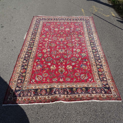 2246 - A hand made  red ground Persian carpet, L300cm x W196cm