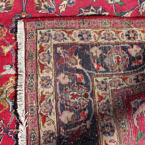 2246 - A hand made  red ground Persian carpet, L300cm x W196cm