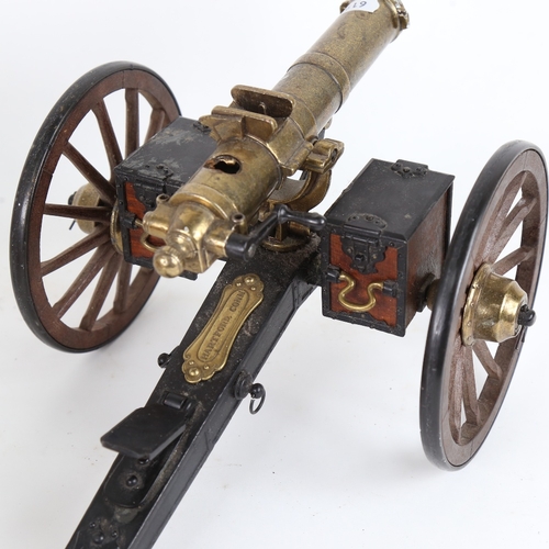 11 - A detailed desktop model of a Gatling field gun, with brass plaque stamped Hartford, Conn, working c... 