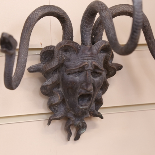 113 - A bronze wall-mounted Medusa mask coat hanger, width 34cm