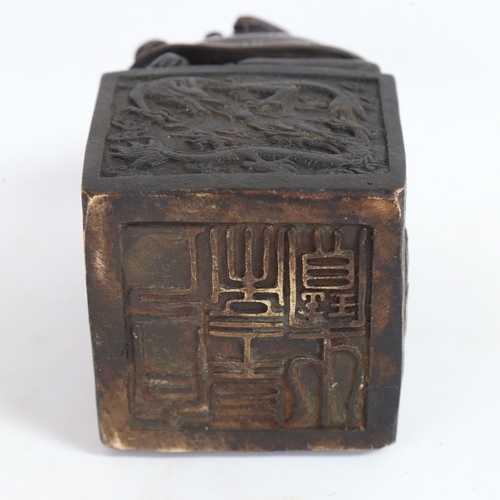 65 - A large Chinese patinated bronze desk seal, dragon decoration, with character mark base, height 13cm