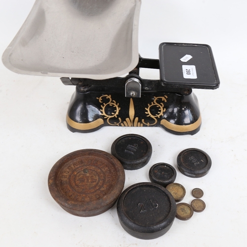 280 - A set of painted and gilded cast-iron scales and weights