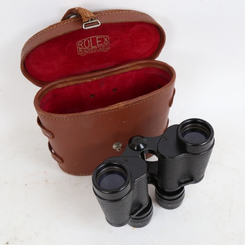 282 - A pair of Rolex 8x30 binoculars, serial no. 15637, in original fitted leather case