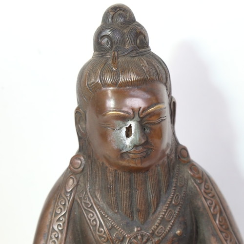 315 - A large Chinese patinated bronze seated Buddha, height 30cm, holes