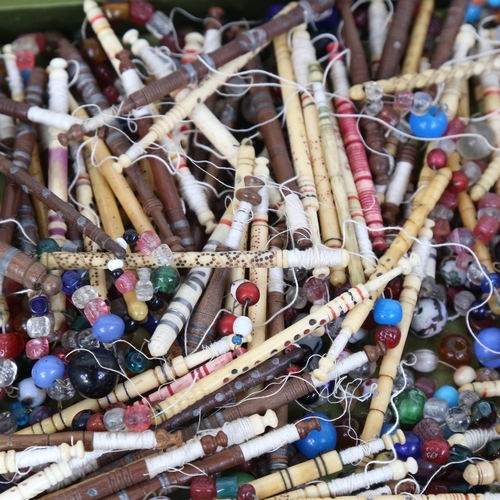 322 - A large quantity of various Vintage bobbins, including turned bone and wood, approx 150