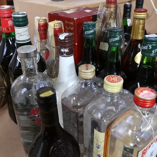 325 - A large quantity of various spirits, including Vodka, Gin and Martini