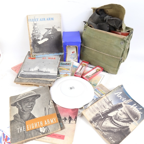 348 - Various military related items, including gas mask, magazines and collector's plates (boxful)