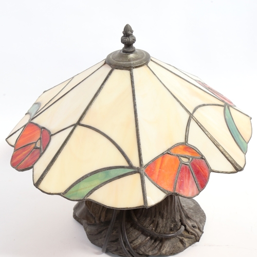 389 - A Vintage Tiffany style leadlight table lamp, with resin pixie design base, by B Kerck, overall heig... 